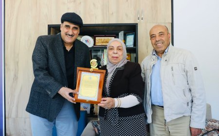 العنزى يكرم فتح الله 